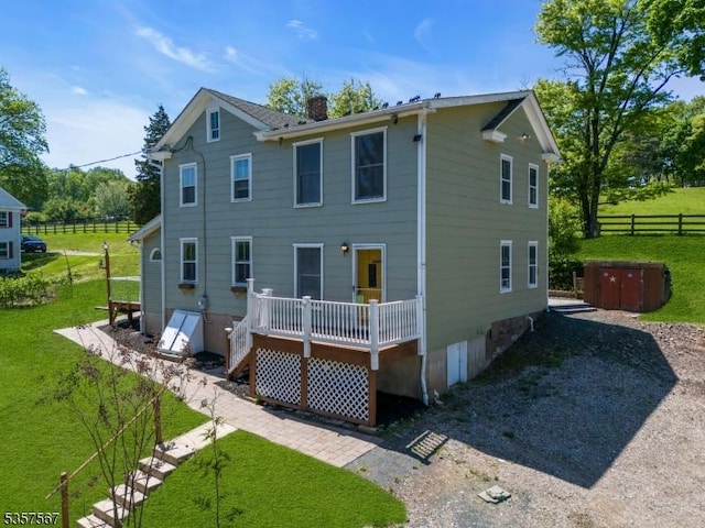 392 Pittstown Rd, Franklin Twp, NJ 08867 - rear view of house featuring a deck and a chimney