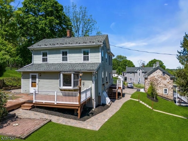 392 Pittstown Rd, Franklin Twp, NJ 08867 - back of property with a deck, a chimney, and a lawn