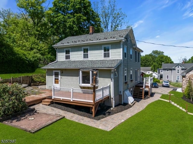 392 Pittstown Rd, Franklin Twp, NJ 08867 - back of property with a wooden deck, a chimney, a yard, and a shingled roof