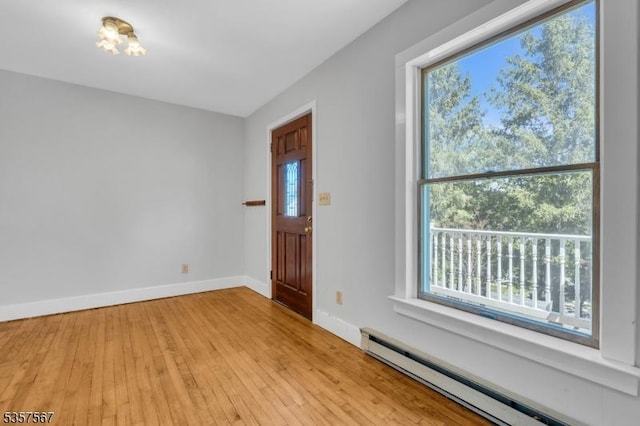 392 Pittstown Rd, Franklin Twp, NJ 08867 - foyer entrance featuring a baseboard heating unit, plenty of natural light, light wood-style flooring, and baseboards