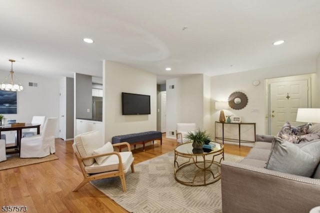 9 Larkin Unit 9, West Orange Twp, NJ 07052 - living room with light wood-style flooring, recessed lighting, a chandelier, and baseboards