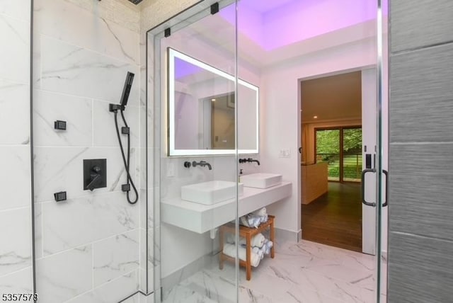 203 Stanhope Rd, Sparta Twp, NJ 07871 - full bathroom featuring a shower stall, marble look tiles, baseboards, and double vanity