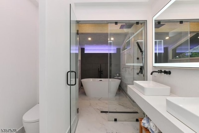 203 Stanhope Rd, Sparta Twp, NJ 07871 - full bathroom featuring a stall shower, marble tiled floors, toilet, a freestanding tub, and double vanity