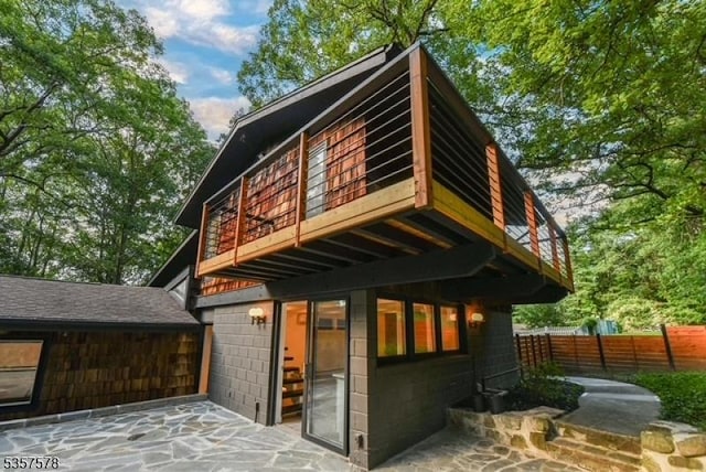 203 Stanhope Rd, Sparta Twp, NJ 07871 - rear view of house with a balcony, fence, and a patio area