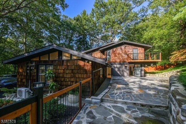 203 Stanhope Rd, Sparta Twp, NJ 07871 - back of house with a balcony and concrete driveway