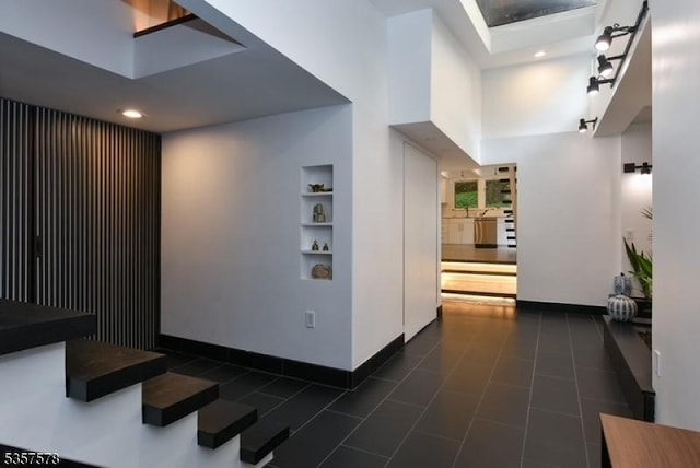 203 Stanhope Rd, Sparta Twp, NJ 07871 - corridor with baseboards, built in features, recessed lighting, and dark tile patterned flooring