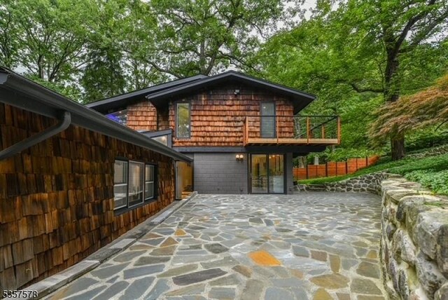 203 Stanhope Rd, Sparta Twp, NJ 07871 - view of side of property with a patio area and a balcony