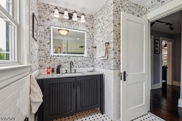 bathroom featuring vanity and a shower