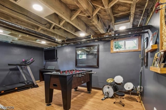 playroom with wood finished floors and baseboards