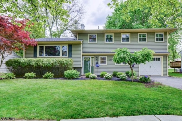 29 Cottage Ln, Springfield Twp, NJ 07081 - split level home featuring a garage, driveway, a front lawn, and a chimney