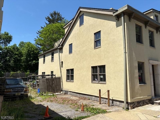 17-21 S Union St, Lambertville City, NJ 08530 - view of home's exterior with stucco siding and fence
