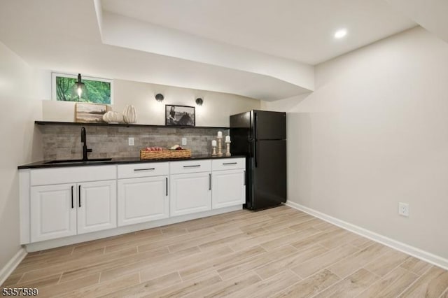 25 Woodcliff Dr, Madison Boro, NJ 07940 - indoor wet bar with freestanding refrigerator, backsplash, light wood-style flooring, and recessed lighting