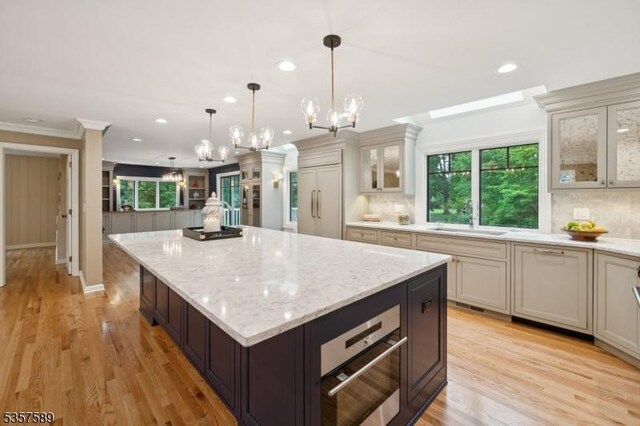25 Woodcliff Dr, Madison Boro, NJ 07940 - kitchen with a chandelier, recessed lighting, tasteful backsplash, plenty of natural light, and ornamental molding