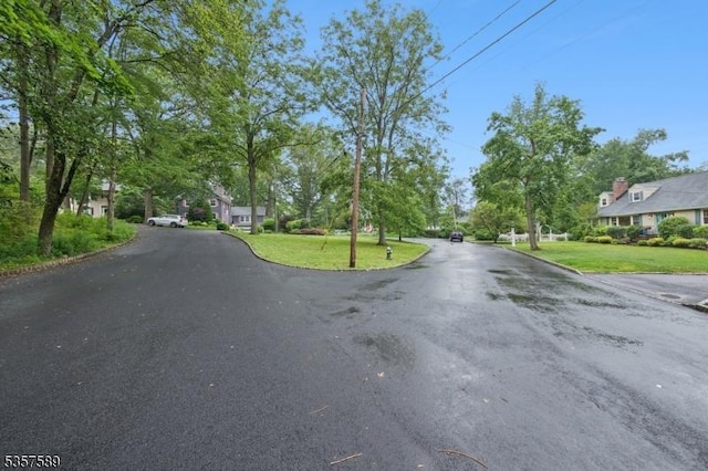 25 Woodcliff Dr, Madison Boro, NJ 07940 - view of asphalt road with curbs and a residential view