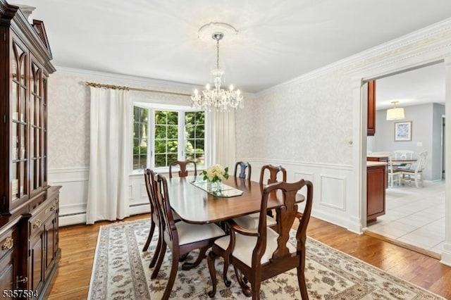 116 Wentworth Dr, Berkeley Heights Twp, NJ 07922 - dining space featuring a chandelier, wallpapered walls, light wood-style floors, a wainscoted wall, and crown molding