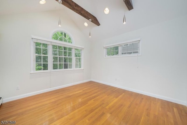 empty room featuring light wood-type flooring and baseboards