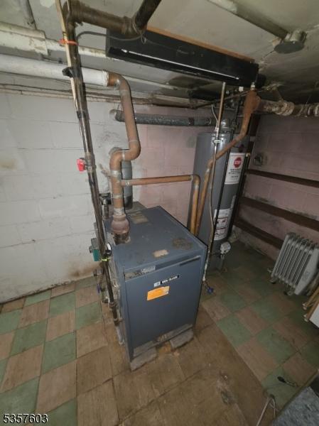 280 Fitzpatrick St, Hillside Twp, NJ 07205 - utility room featuring water heater and a heating unit