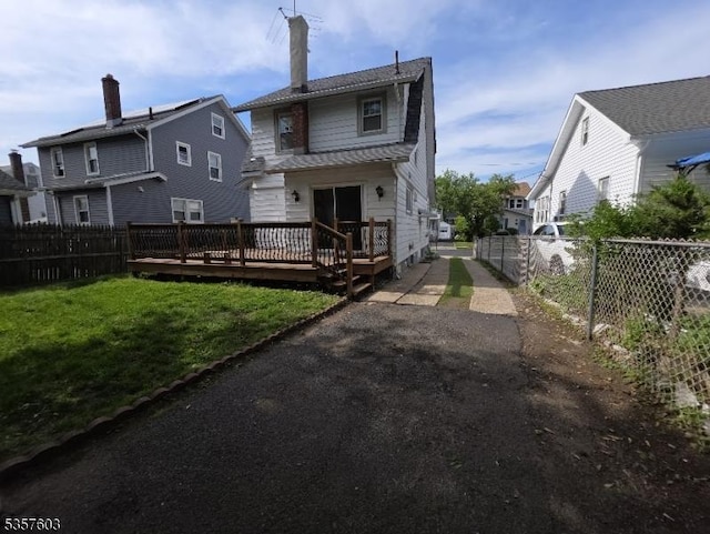 280 Fitzpatrick St, Hillside Twp, NJ 07205 - rear view of property with a wooden deck, a residential view, and driveway