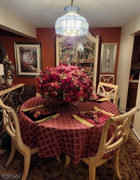 115 Seminole Rd Unit 115, Andover Twp, NJ 07848 - dining area with a chandelier