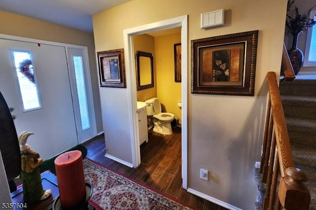 115 Seminole Rd Unit 115, Andover Twp, NJ 07848 - entryway featuring dark wood-style flooring, baseboards, and stairway