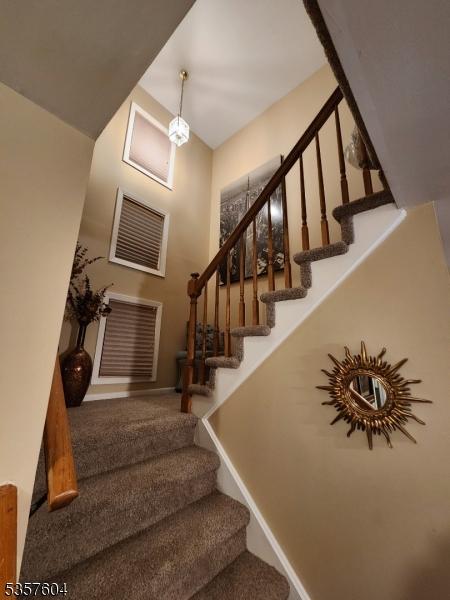 115 Seminole Rd Unit 115, Andover Twp, NJ 07848 - stairway with baseboards