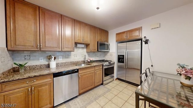 2764 Meister Ave, Union Twp, NJ 07083 - kitchen with stainless steel appliances, a sink, tasteful backsplash, light stone countertops, and light tile patterned flooring