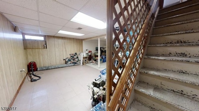 2764 Meister Ave, Union Twp, NJ 07083 - basement with stairway, a drop ceiling, and wooden walls