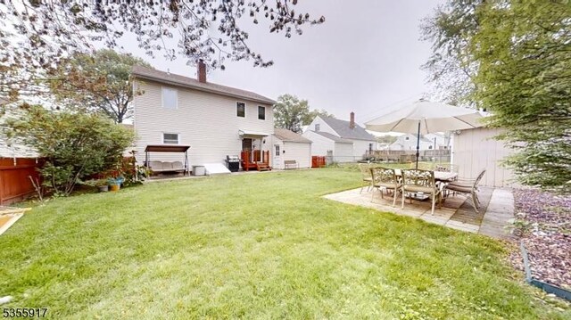 2764 Meister Ave, Union Twp, NJ 07083 - back of property with a chimney, a patio area, and a residential view