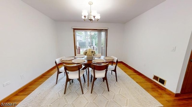 2764 Meister Ave, Union Twp, NJ 07083 - dining space with a chandelier, light wood finished floors, and baseboards