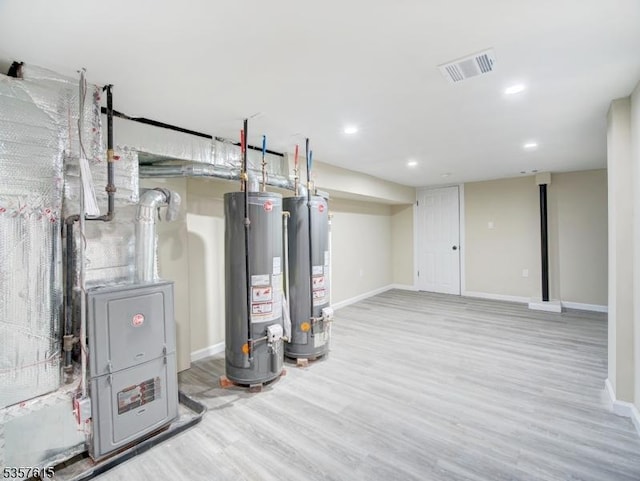 191 Matthew St, City Of Orange Twp, NJ 07050 - finished below grade area featuring water heater, wood finished floors, recessed lighting, and baseboards