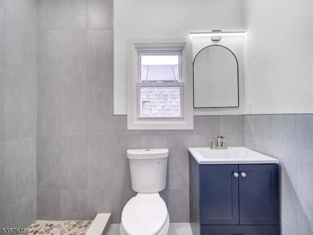 191 Matthew St, City Of Orange Twp, NJ 07050 - bathroom with toilet, vanity, tiled shower, and tile walls