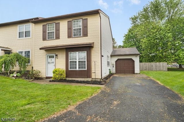 view of front of house featuring asphalt driveway