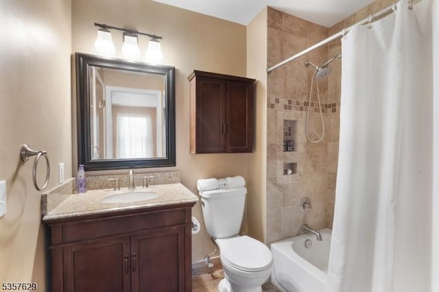 full bathroom with vanity, toilet, and shower / tub combo
