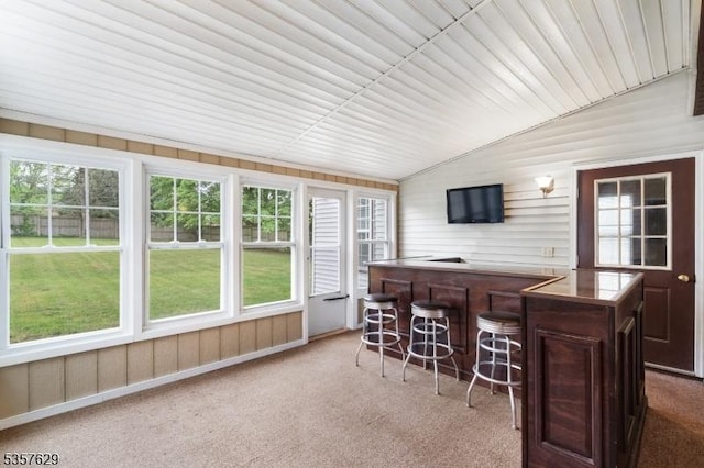 sunroom / solarium with plenty of natural light and lofted ceiling