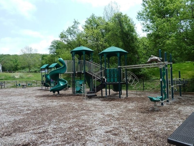 communal playground featuring fence