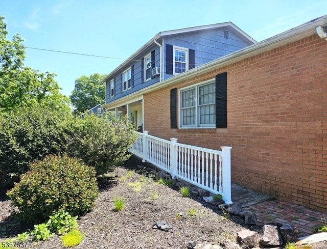 view of home's exterior featuring brick siding