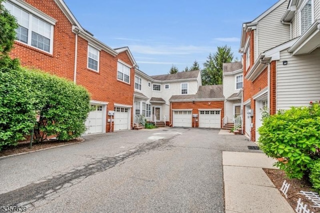 view of asphalt road featuring a residential view