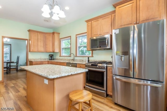 100 W Hanover Ave, Morris Twp, NJ 07950 - kitchen with appliances with stainless steel finishes, a chandelier, a center island, light wood-style floors, and recessed lighting