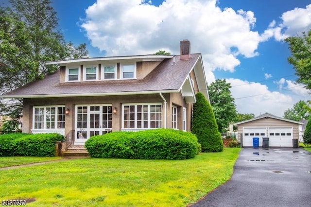 100 W Hanover Ave, Morris Twp, NJ 07950 - view of front facade featuring a detached garage, a chimney, an outdoor structure, and a front yard