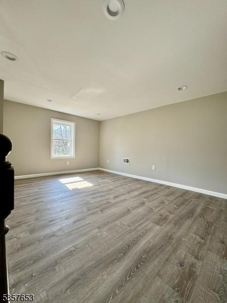 261 Hickory St, City Of Orange Twp, NJ 07050 - empty room featuring baseboards and wood finished floors