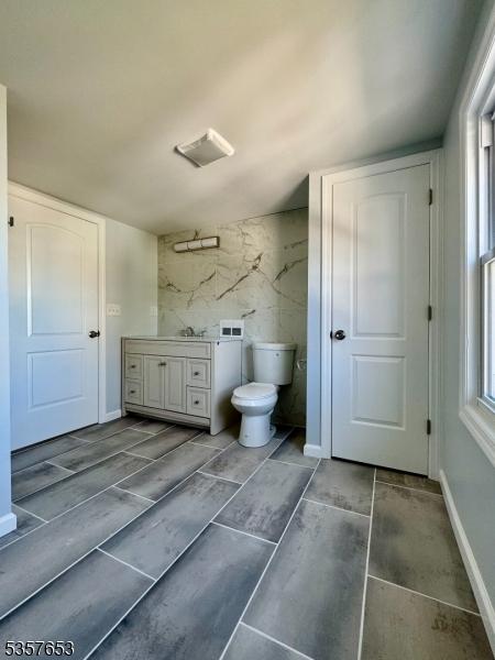 261 Hickory St, City Of Orange Twp, NJ 07050 - bathroom featuring toilet, wood finish floors, and vanity