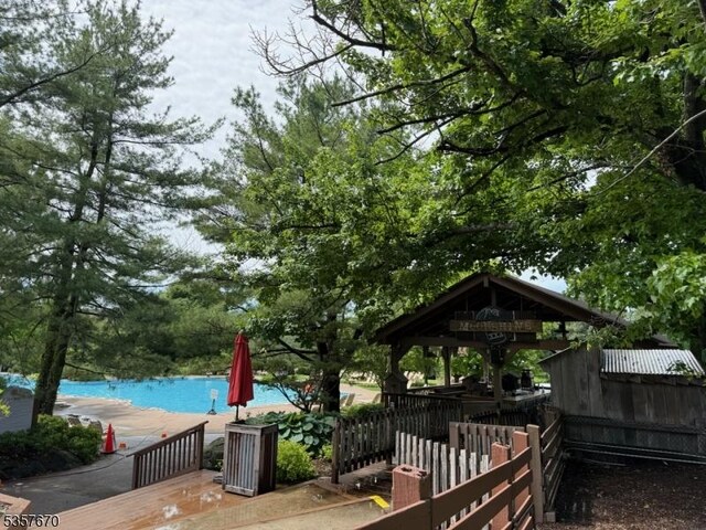 7 Deer Valley Ln Unit 6, Vernon Twp, NJ 07462 - deck featuring a swimming pool and a gazebo