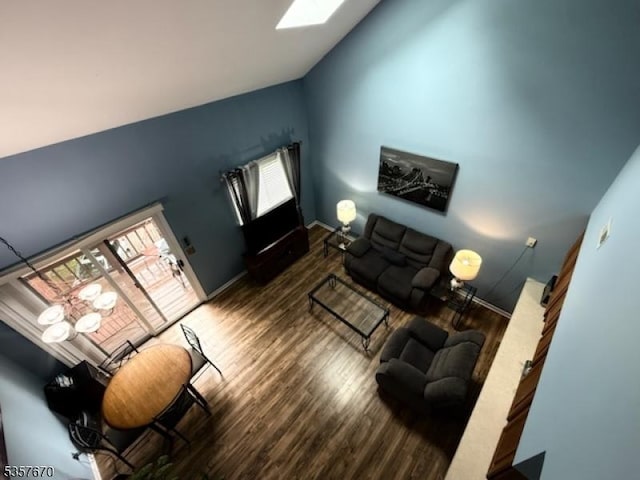 7 Deer Valley Ln Unit 6, Vernon Twp, NJ 07462 - living room featuring vaulted ceiling, wood finished floors, a skylight, and baseboards