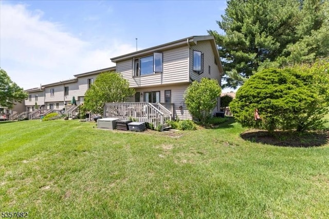 287 Cheyenne Rd, Andover Twp, NJ 07848 - rear view of property with a lawn and a wooden deck