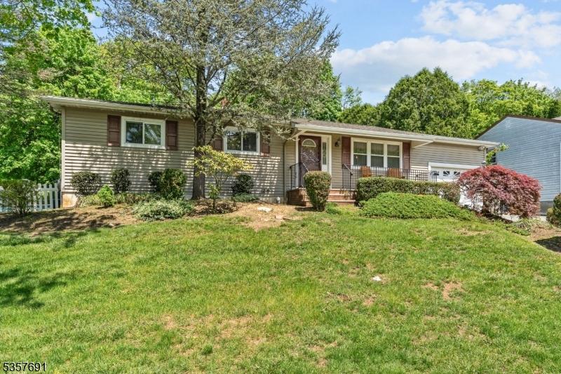6 Rosemont Rd, Jefferson Twp, NJ 07438 - view of front of house with an attached garage and a front yard