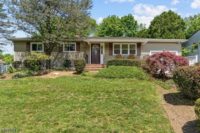 single story home with a garage and a front yard