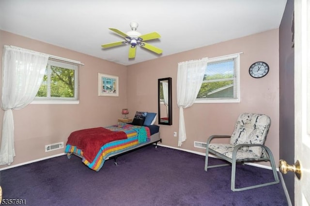 bedroom with dark colored carpet, baseboards, and ceiling fan