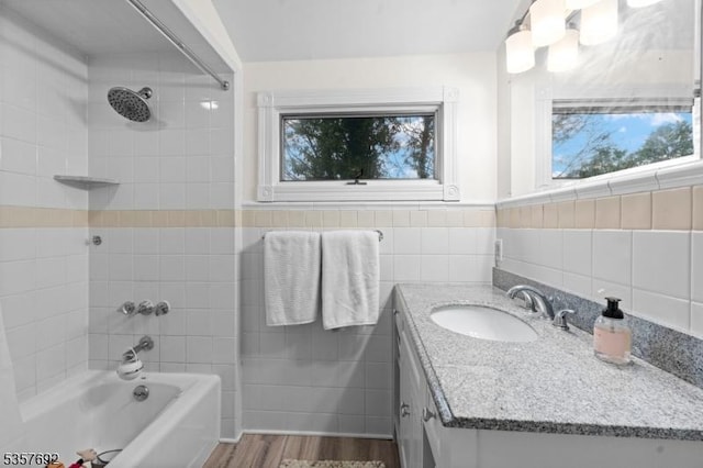 77 E Main St, Mendham Boro, NJ 07945 - bathroom with shower / bathtub combination, vanity, tile walls, and wood finished floors