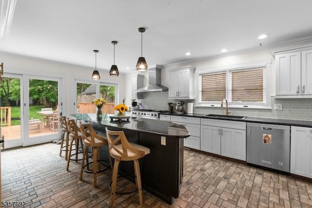 77 E Main St, Mendham Boro, NJ 07945 - kitchen featuring dishwasher, wall chimney exhaust hood, a sink, dark countertops, and brick floors