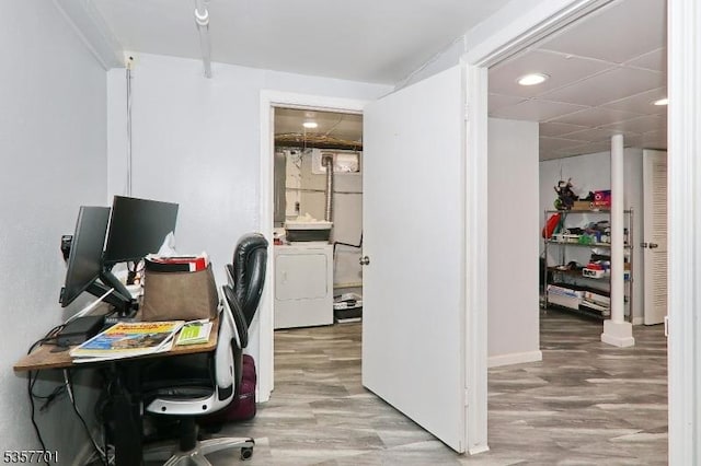 office space with washer / dryer and wood finished floors